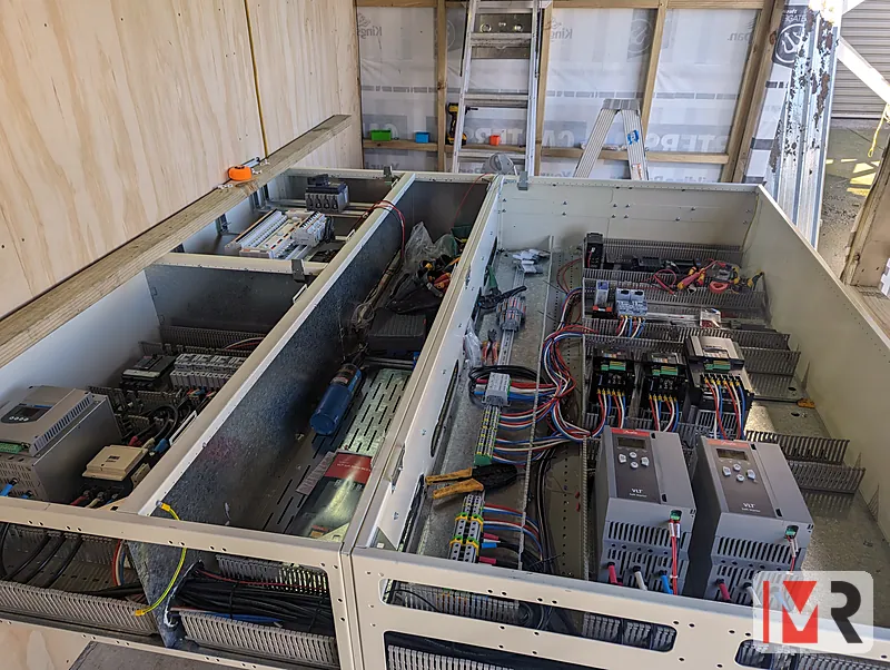 Large control panel under construction with drives and PLC mounted