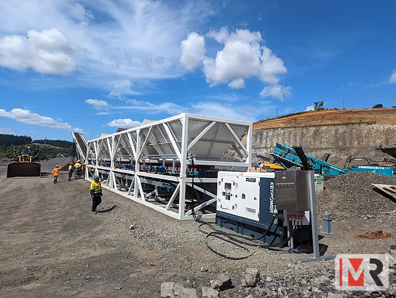 Aggregate plant feeder bins and conveyors on a quarry site