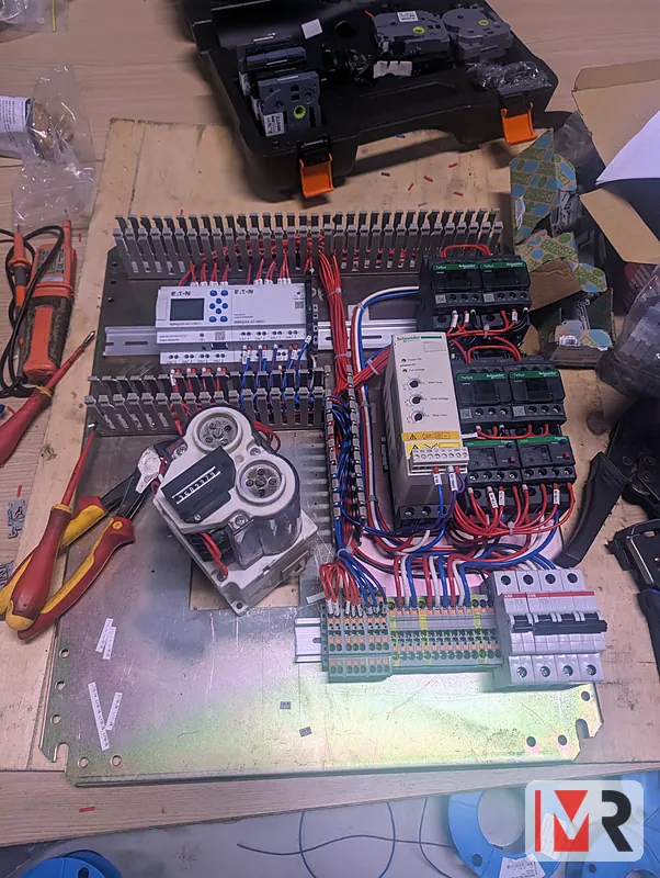 Control panel with PLC and relays being built on the bench