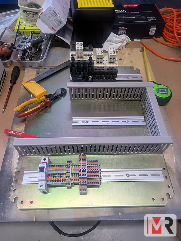 Back plate with DIN rail and wiring duct for a new control panel
